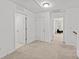 Upstairs hallway leading to bedrooms, features neutral carpets at 2461 Palmdale Walk Dr, Fort Mill, SC 29708
