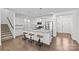 Well-appointed kitchen with white cabinets, granite island and stainless appliances at 2461 Palmdale Walk Dr, Fort Mill, SC 29708