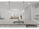 Kitchen island with granite countertop and stainless steel sink, and stainless steel dishwasher at 2461 Palmdale Walk Dr, Fort Mill, SC 29708