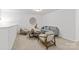 Loft features neutral colors and comfortable seating, ideal for a cozy retreat at 2461 Palmdale Walk Dr, Fort Mill, SC 29708