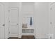 Clean mudroom featuring a built-in bench with hooks, offering practical storage solutions at 2461 Palmdale Walk Dr, Fort Mill, SC 29708