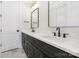 The bathroom has double sinks, framed mirrors, and modern fixtures at 3907 Plainview Rd, Charlotte, NC 28208