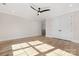 Large bedroom with wood flooring, neutral walls, and a spacious closet for ample storage at 3907 Plainview Rd, Charlotte, NC 28208