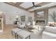 Cozy living area with a modern fireplace, wood beam ceiling, and views of the dining area at 3907 Plainview Rd, Charlotte, NC 28208