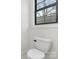 Modern powder room with a sleek toilet and contemporary fixtures, perfect for guests at 3907 Plainview Rd, Charlotte, NC 28208