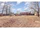 Spacious backyard with playset, trampoline, and back deck with room for activities at 4000 Elizabeth St, Hickory, NC 28601