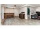 Finished basement area with bar, wood-look floors, and stairs to the upper level at 4000 Elizabeth St, Hickory, NC 28601