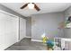 Bedroom featuring laminate floors, a closet with white doors, and sun-themed wall decor at 4000 Elizabeth St, Hickory, NC 28601