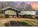 Exterior of home with light gray siding, tidy front yard, and welcoming front entrance at 4000 Elizabeth St, Hickory, NC 28601