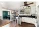 Modern kitchen featuring black countertops, white cabinets, and a view into the dining room at 4000 Elizabeth St, Hickory, NC 28601