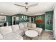 Stylish living area showcasing green walls, recessed lighting, and comfortable seating at 4000 Elizabeth St, Hickory, NC 28601