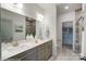 Elegant bathroom with double vanity, neutral color palette, and modern fixtures at 4230 Black Ct # 235, Harrisburg, NC 28075