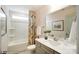 Well-lit bathroom featuring a shower-tub combo, and a neutral-toned vanity at 4230 Black Ct # 235, Harrisburg, NC 28075