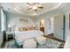 Cozy bedroom with tray ceilings and a private bathroom access creates a private and tranquil space at 4230 Black Ct # 235, Harrisburg, NC 28075
