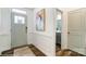 Bright foyer with hardwood floors, wainscoting, and a view into the bathroom at 4230 Black Ct # 235, Harrisburg, NC 28075