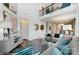Stylish living room with soaring ceilings, contemporary furnishings, and open floor plan to kitchen at 4230 Black Ct # 235, Harrisburg, NC 28075