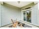 View of the patio area with outdoor seating and sliding glass doors to the inside of the house at 4230 Black Ct # 235, Harrisburg, NC 28075