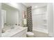 Bathroom featuring a vanity with a sink, a mirror, and a shower/tub combo with stylish design elements at 4236 Black Ct # 234, Harrisburg, NC 28075