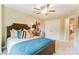 Well-decorated bedroom with a cozy bed, side table, and an inviting ambiance enhanced by natural light at 4236 Black Ct # 234, Harrisburg, NC 28075