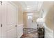 Bright foyer with tray ceiling, decorative rug, and sidelight windows on the front door at 4236 Black Ct # 234, Harrisburg, NC 28075