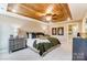 Bright bedroom with wood ceiling, elegant decor, and natural light creating a peaceful retreat at 4236 Black Ct # 234, Harrisburg, NC 28075