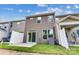 Grassy backyard with private patio, fenced in, with exterior access to the home at 4242 Black Ct # 233, Harrisburg, NC 28075