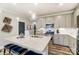 Stylish kitchen features a granite island, stainless steel appliances and a gas range at 4242 Black Ct # 233, Harrisburg, NC 28075