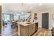 Open kitchen with a granite island, stainless steel dishwasher, and an open floor plan at 4242 Black Ct # 233, Harrisburg, NC 28075