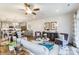 Open concept living room and kitchen with hardwood floors, white cabinets, and decor at 4242 Black Ct # 233, Harrisburg, NC 28075