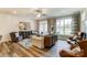 Open-concept living room features hardwood floors, modern decor, and ample seating at 4242 Black Ct # 233, Harrisburg, NC 28075