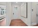 Bright entryway with wood floors, white walls, and modern art at 4785 Formation Ct # 101, Lancaster, SC 29720