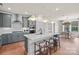 Bright kitchen with an island and bar seating, gray cabinets, stainless appliances, and an adjacent breakfast area at 4785 Formation Ct # 101, Lancaster, SC 29720