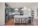 Spacious kitchen with a large island, gray cabinetry, stainless steel appliances, and hardwood floors at 4785 Formation Ct # 101, Lancaster, SC 29720