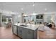 Open kitchen with a center island, stainless steel appliances, and view of the living room at 4785 Formation Ct # 101, Lancaster, SC 29720