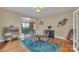 Hardwood dining room with a glass-top table, area rug, and a view of the kitchen at 528 Mitchell Ave, Salisbury, NC 28144