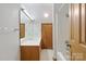 Bathroom featuring a white countertop, wood cabinets, large mirror and a shower at 5580 Crepe Myrtle Rd, York, SC 29745