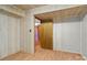 Bedroom featuring neutral colored walls and laminate flooring, with a doorway leading to another room at 5580 Crepe Myrtle Rd, York, SC 29745