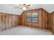 Wood-paneled bedroom with a ceiling fan and carpeted floors at 5580 Crepe Myrtle Rd, York, SC 29745
