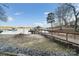 Scenic waterfront view featuring a private dock, gazebo and boat, perfect for lake activities at 5580 Crepe Myrtle Rd, York, SC 29745