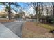 Long driveway leading to a charming home with a two-car garage and surrounded by lush trees at 5580 Crepe Myrtle Rd, York, SC 29745