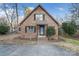 Inviting brick home with a cozy front porch and landscaped garden at 5580 Crepe Myrtle Rd, York, SC 29745