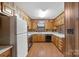 Traditional kitchen with wooden cabinets, white countertops, and classic appliances at 5580 Crepe Myrtle Rd, York, SC 29745