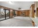Bright living room with a brick fireplace, sliding doors, and a ceiling fan at 5580 Crepe Myrtle Rd, York, SC 29745
