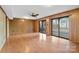 Spacious living room with wood laminate flooring and a wall of sliding glass doors at 5580 Crepe Myrtle Rd, York, SC 29745