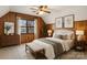 Comfortable bedroom featuring paneled walls, natural light, and simple décor for a relaxing atmosphere at 5580 Crepe Myrtle Rd, York, SC 29745