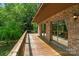 Spacious wooden deck with brick facade and glass doors overlooking the backyard at 5580 Crepe Myrtle Rd, York, SC 29745