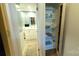 This is a well-organized bathroom with storage for linens and a tiled floor at 7005 Stonington Ln, Charlotte, NC 28227