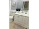 This bathroom features a large mirror, modern fixtures, and a clean design at 7005 Stonington Ln, Charlotte, NC 28227