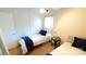 Cozy bedroom featuring two twin beds, a side table, and natural light at 7005 Stonington Ln, Charlotte, NC 28227
