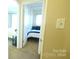 Cozy bedroom featuring a comfortable bed with blue pillows, offering a peaceful retreat at 7005 Stonington Ln, Charlotte, NC 28227